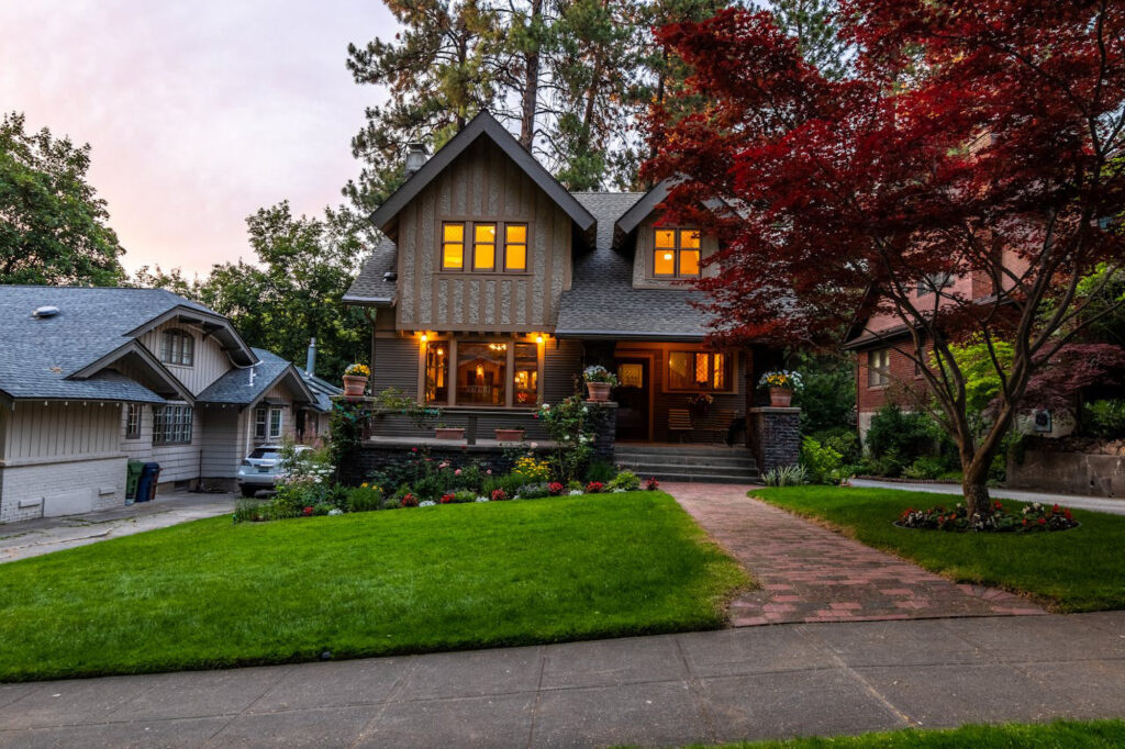 High-end residential property in Glendale featuring well-maintained wood siding and stone architecture, showcasing architectural preservation standards by Flawless Facade.